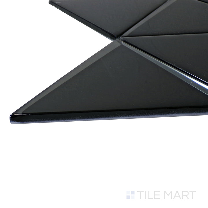 A corner shot of the Modern Glass Black 6" Triangle glossy mosaic tile highlights its deep black shade and sleek triangular design, perfect for bold and modern spaces.