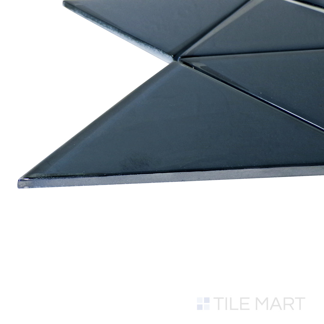 Captured from a corner angle, the Modern Glass Blue 6" Triangle glossy mosaic tile showcases its vibrant blue tone and triangular arrangement, adding a dynamic and artistic touch.