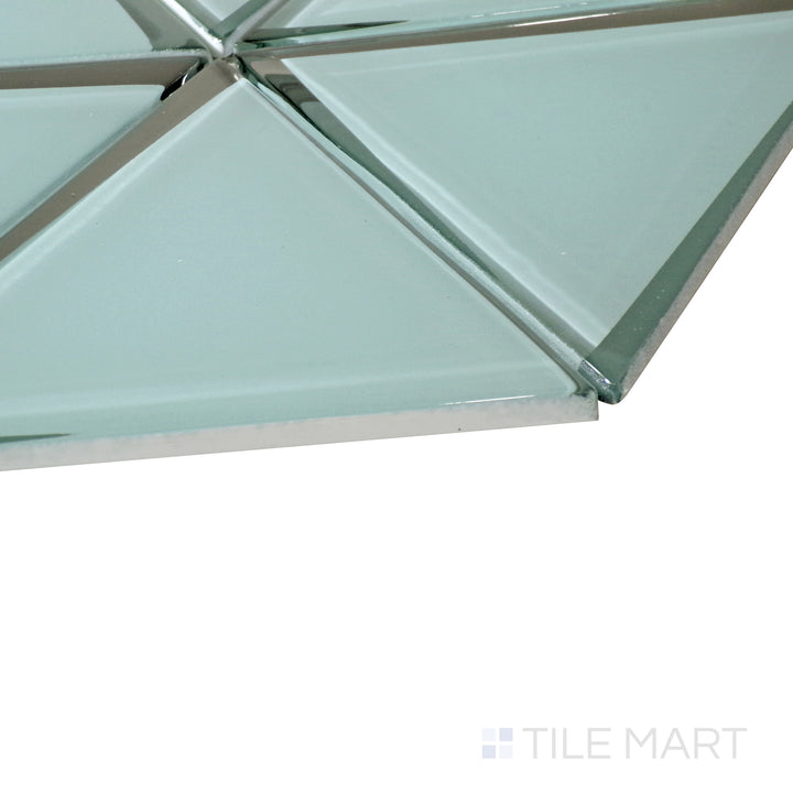 Vibrant green glass tiles form a striking triangle pattern, with a side-angle shot enhancing the luminous effect.