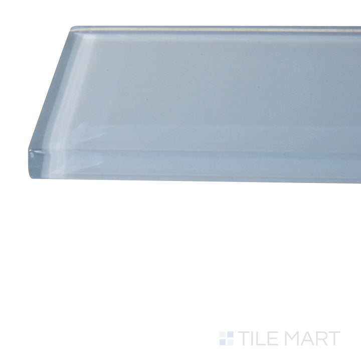 A corner shot of the Glass Pastel Blue 3x12 glossy tile highlights its soft pastel blue hue and polished surface, adding a fresh and airy touch to walls and backsplashes.