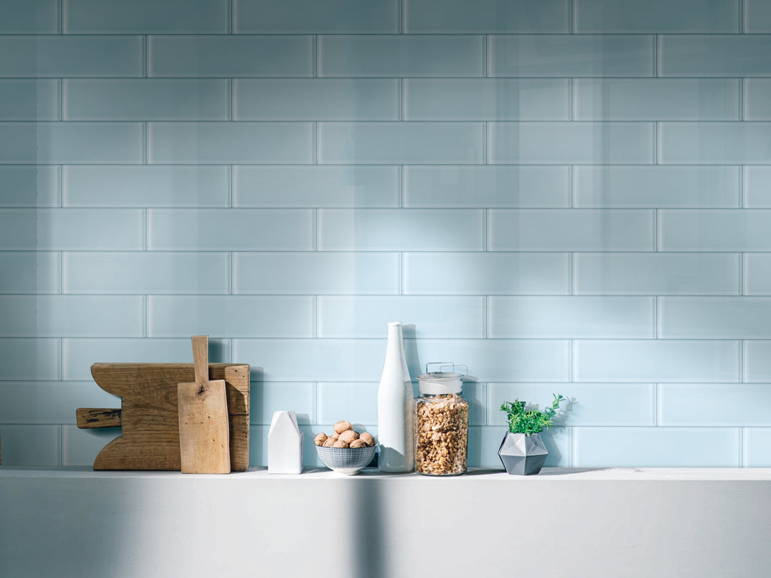 A fresh and vibrant lifestyle scene featuring Glass Pastel Blue glossy tile, infusing a soft yet modern aesthetic.
