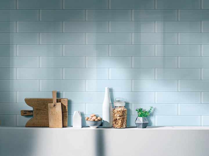 A fresh and vibrant lifestyle scene featuring Glass Pastel Blue glossy tile, infusing a soft yet modern aesthetic.