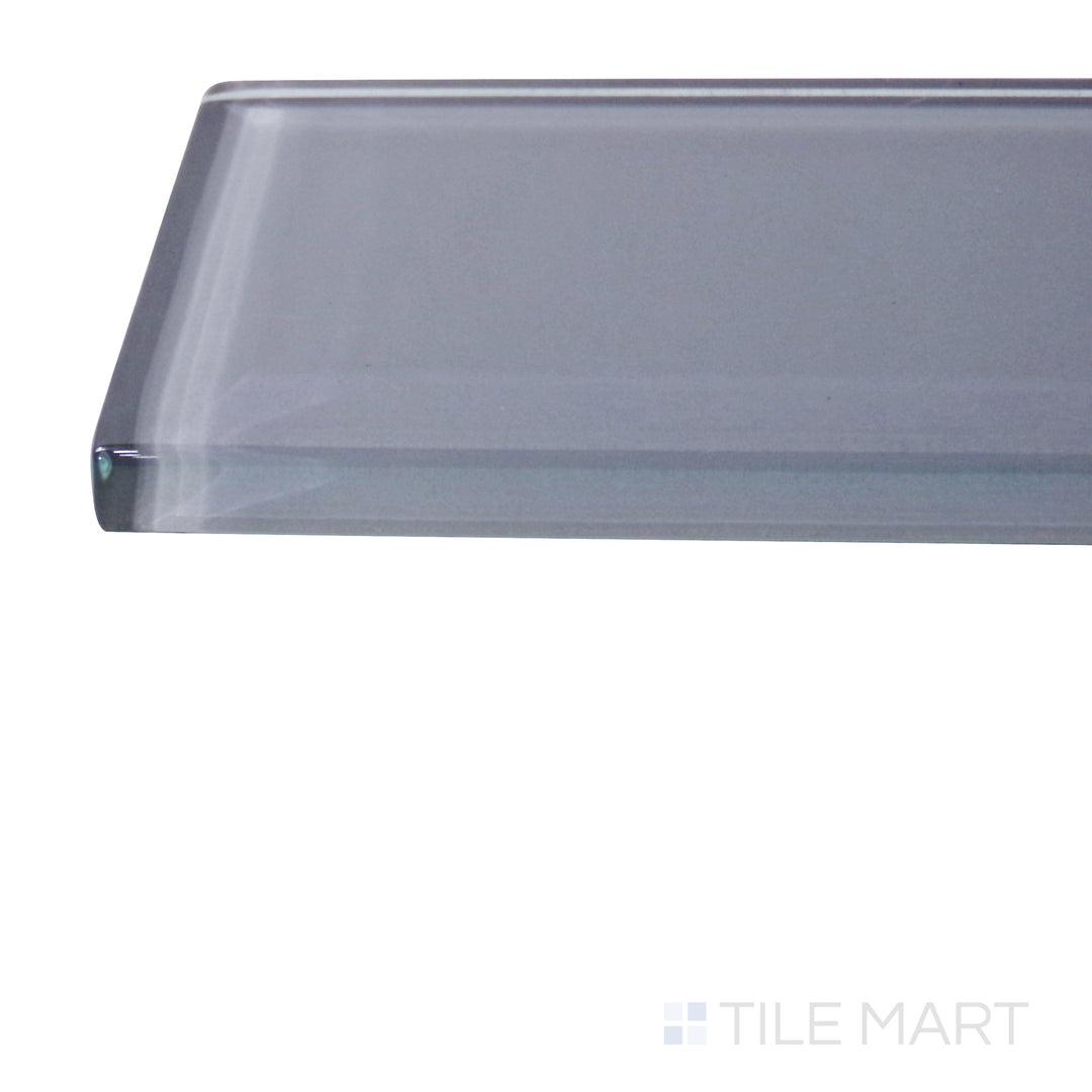 A corner perspective of the Glass Pastel Grey 3x12 glossy tile emphasizes its soft gray tones and sleek glossy texture, creating a timeless and sophisticated design.