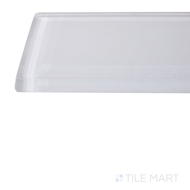Captured from a corner angle, the Glass Pastel White 3x12 glossy tile showcases its bright white hue and polished finish, enhancing spaces with a clean and luminous effect.