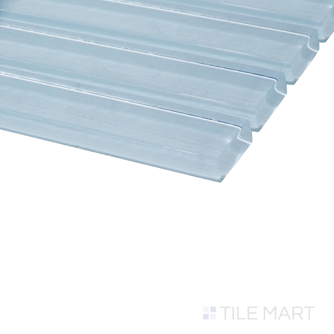 A striking angle captures the pastel blue grid mosaic, enhancing its glossy finish and structured layout with depth and dimension.