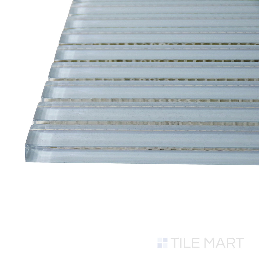 A corner shot of the Glass Pastel Blue Grid glossy mosaic tile highlights its soft blue tone and structured grid pattern, adding depth and texture to tiled surfaces.