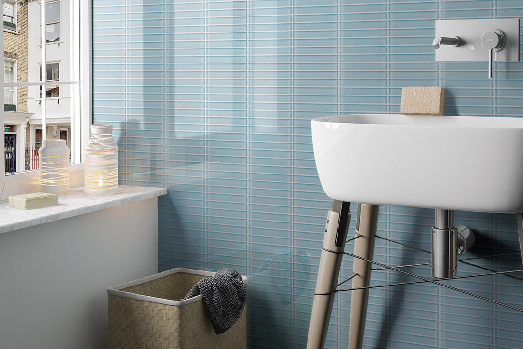A sleek lifestyle setting with Glass Pastel Blue Grid glossy mosaic, blending structured design with calming hues.