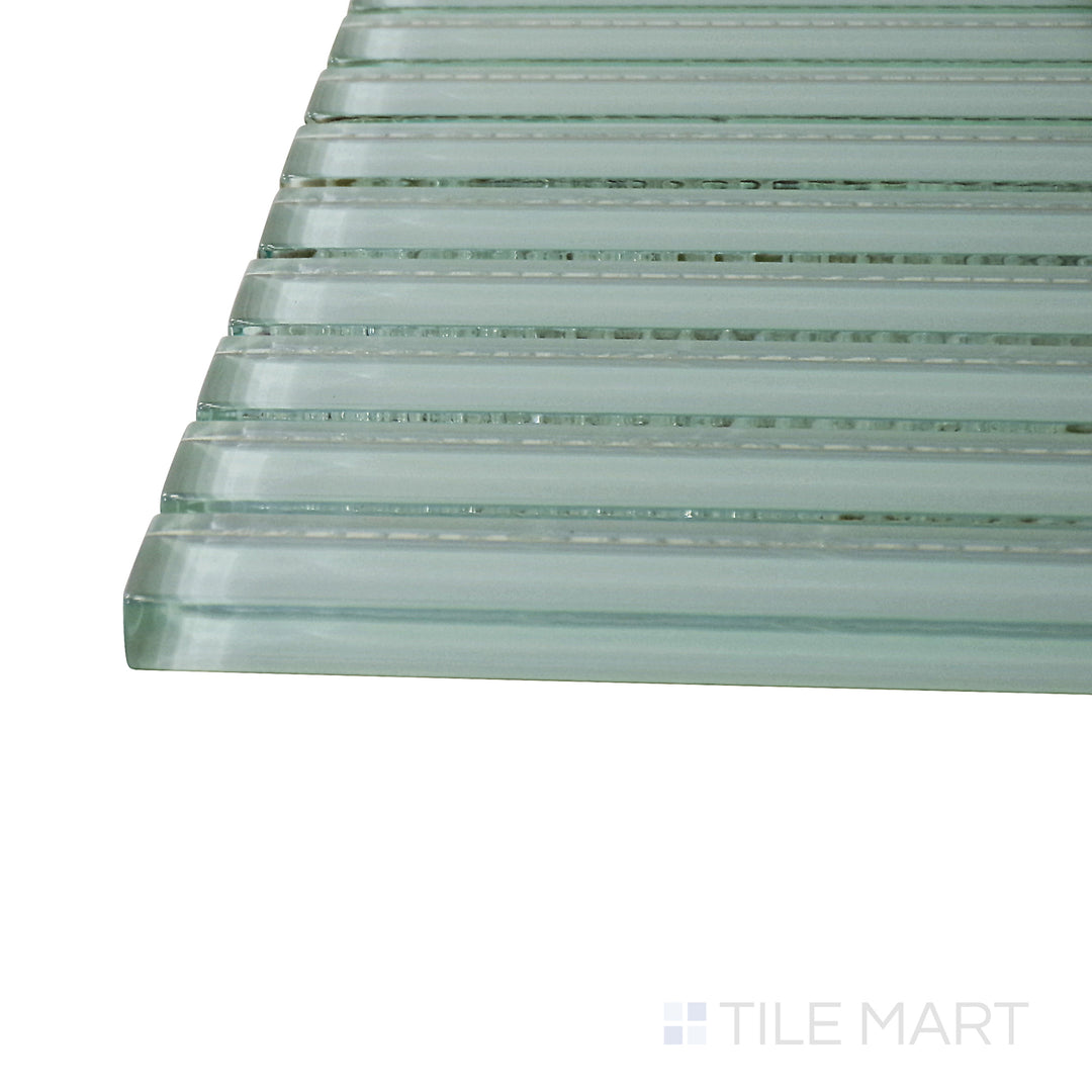 Captured from a corner angle, the Glass Pastel Green Grid glossy mosaic tile showcases its muted green hue and precise grid design, perfect for modern and nature-inspired spaces.