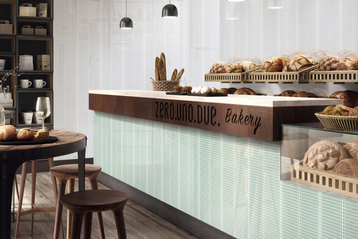 A stylish space brought to life with Glass Pastel Green Grid glossy mosaic, delivering a refreshing and contemporary edge.