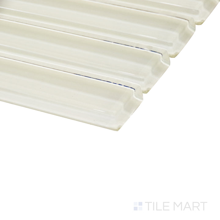 A golden pastel yellow grid mosaic reflects light beautifully from this angled view, capturing its glossy surface and crisp pattern.