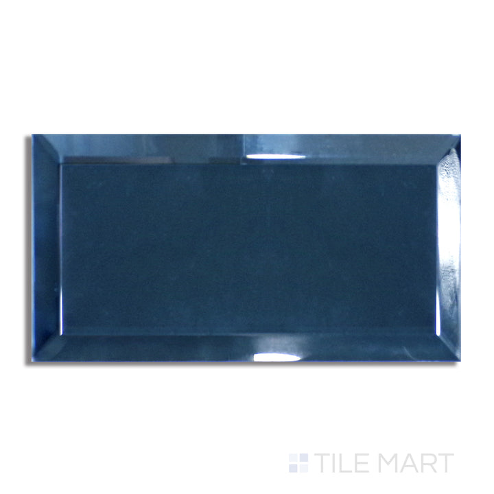 Flat lay of Glass Reflections Steel 3X6 Beveled Glossy, showcasing a bold steel grey tone with a polished, reflective surface and beveled edges.