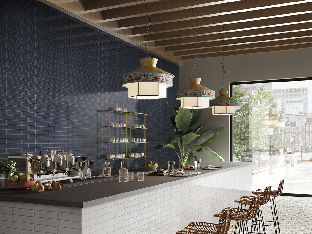 A sophisticated lifestyle image featuring Glass Reflections Steel beveled glossy tile, offering depth and brilliance.