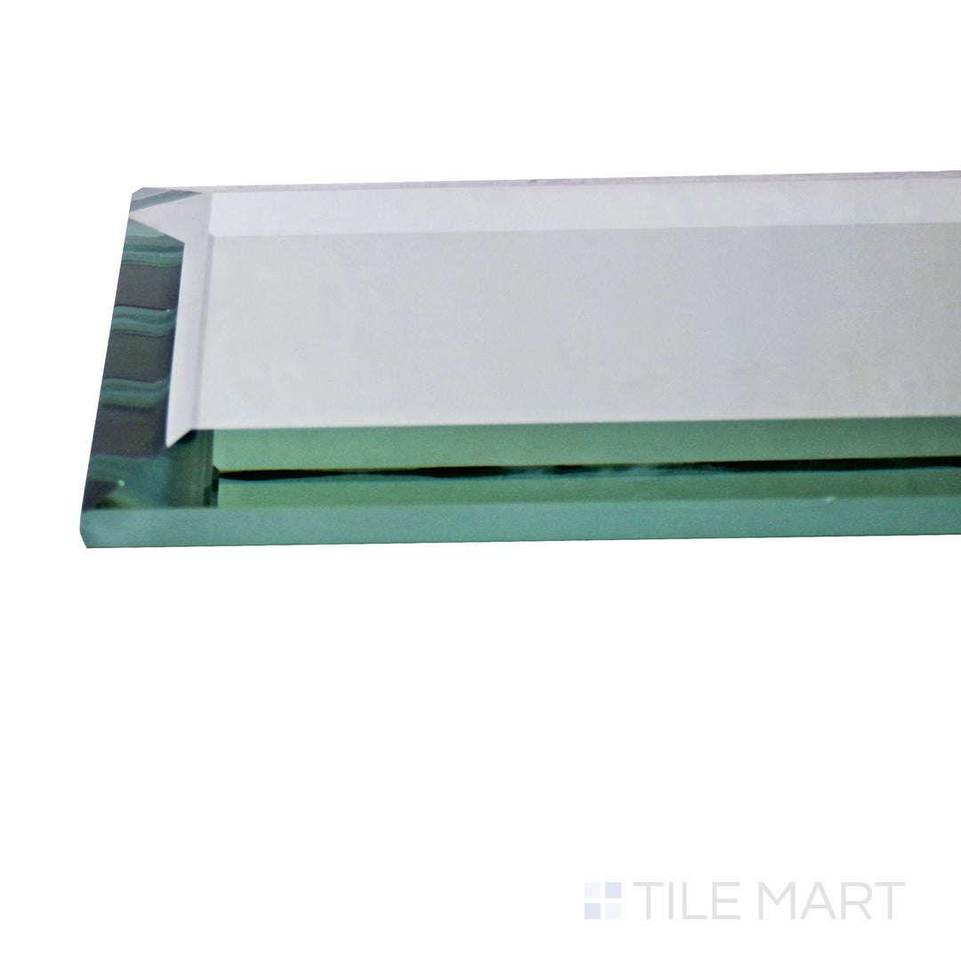 Captured from a corner angle, the Glass Reflections Platinum 4x12 beveled glossy tile showcases its bright platinum hue and elongated beveled edges, adding a high-end and reflective touch.