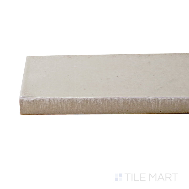 A corner shot of the Gleeze Beige 2x6 glossy porcelain tile highlights its warm beige tones and polished surface, offering a refined and inviting aesthetic.