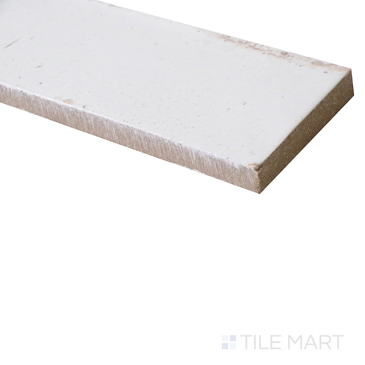 Captured from an angle, this glossy Bianco porcelain tile showcases a pristine white finish with a sleek, luminous surface.