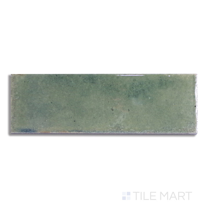 Flat lay of Gleeze Giada 2X6 Glossy Porcelain, highlighting a soft green tone with a polished, glossy finish for a refreshing design.