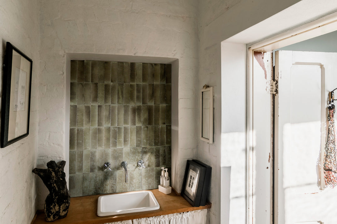 A sophisticated and versatile space with Gleeze Grigio glossy porcelain, delivering a refined neutral tone.