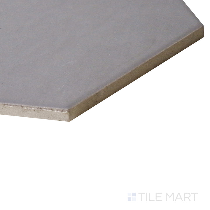 An angled view highlights the crisp white surface of this Blanco hexagon tile, showing off its geometric charm and velvety matte finish.