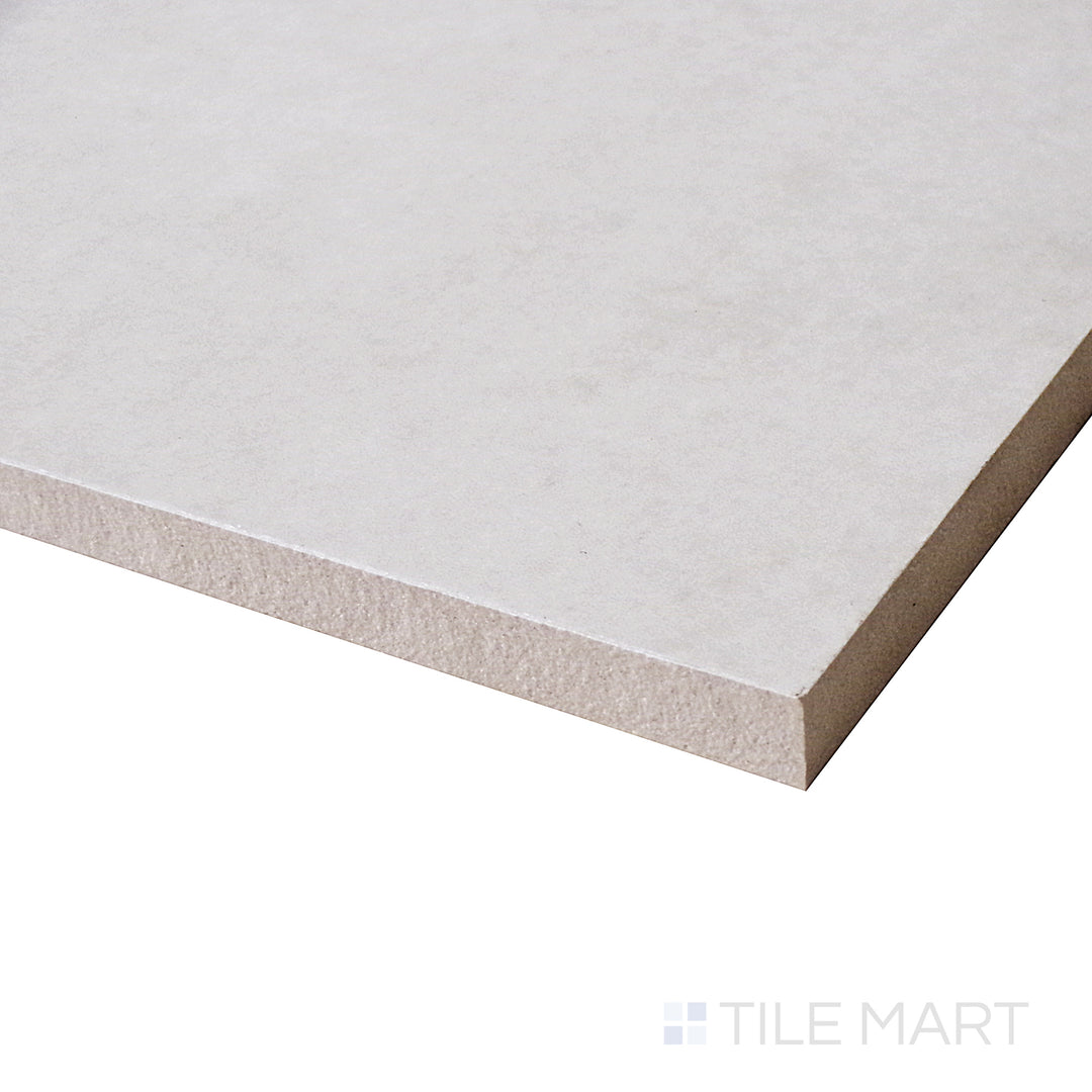 A reflective angle captures the radiant surface of this Perla tile, showcasing its polished sheen and contemporary appeal.