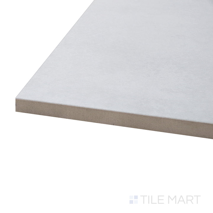 A corner perspective of the Kadence Perla 48x48 polished porcelain tile emphasizes its soft neutral tones and polished finish, making it an ideal choice for upscale interiors.