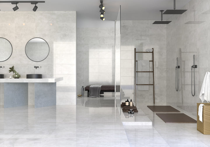 A serene and contemporary setting elevated by Kadence Perla polished porcelain, reflecting light beautifully for a spacious feel.