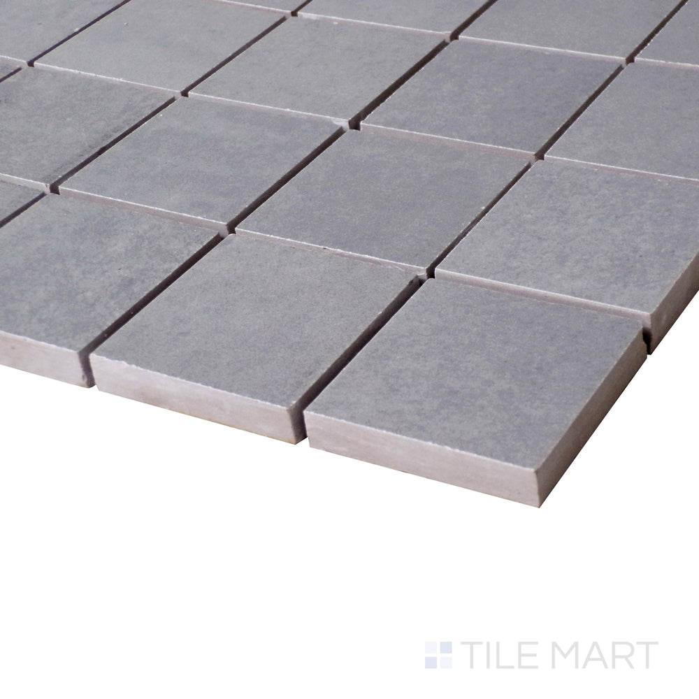 An angled close-up highlights the deep, sophisticated gray tones of this Marengo mosaic, with a subtle matte finish.