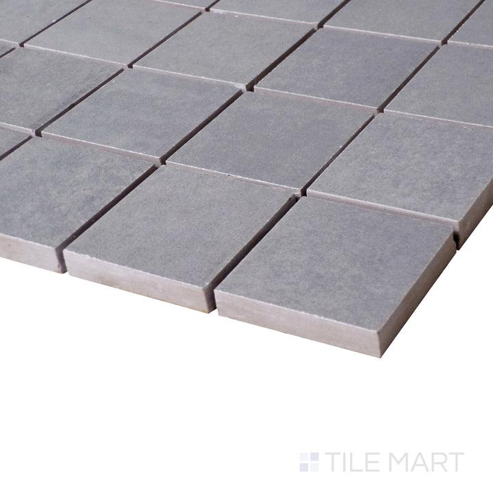 An angled close-up highlights the deep, sophisticated gray tones of this Marengo mosaic, with a subtle matte finish.