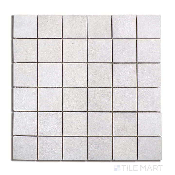 Top-down perspective of Kadence Perla 2" Square Matte Porcelain Mosaic, showcasing a soft pearly grey hue in a compact square mosaic.