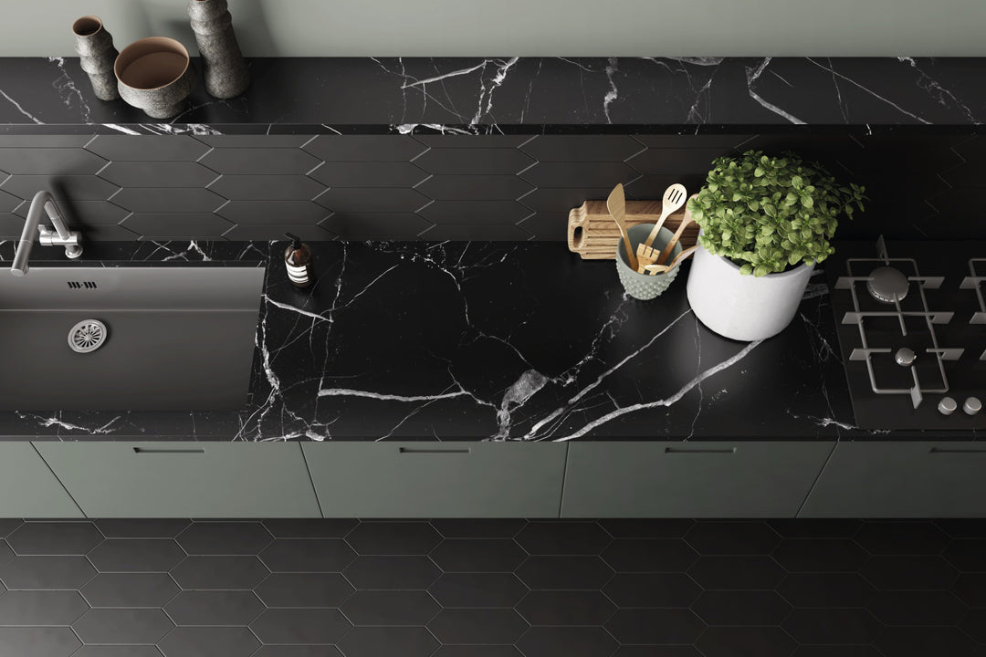 A modern and dramatic ambiance featuring Kite Black matte porcelain, embracing bold, sleek aesthetics.