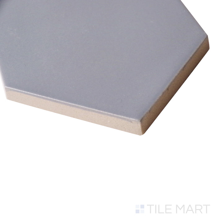 An angled perspective showcases the rich dark gray finish of this matte tile, highlighting its modern appeal and refined surface.