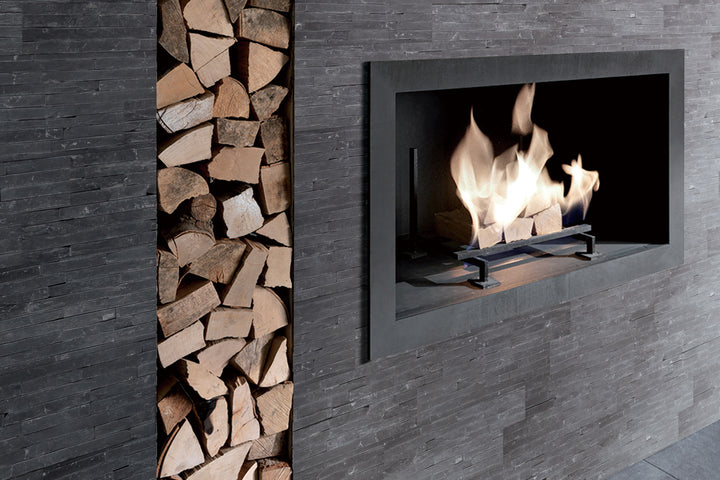 A striking roomscene featuring Contemporary Mini Ledgestone Charcoal 6X24 natural stone, adding depth and texture to a sophisticated space.