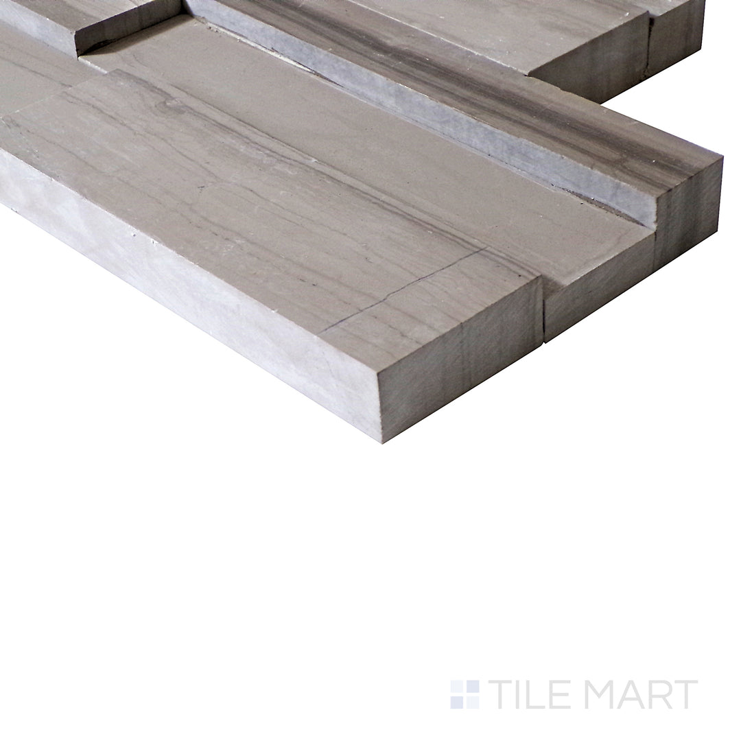 An angled shot reveals the realistic wood grain detail and warm brown tones of this Athens Wood ledgestone porcelain tile.