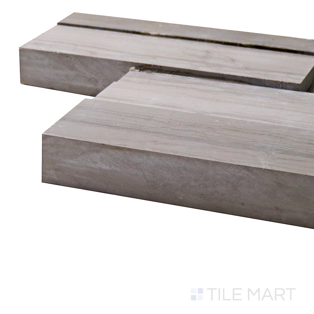 A corner shot of the Modern Ledgestone Athens Wood 6x24 porcelain tile highlights its natural wood-inspired texture and earthy tones, offering a rustic yet modern aesthetic.