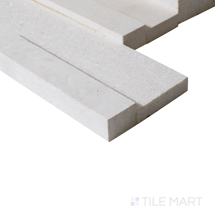 An angled close-up highlights the fresh white tones and structured texture of this Blanc ledgestone tile, enhancing its modern aesthetic.