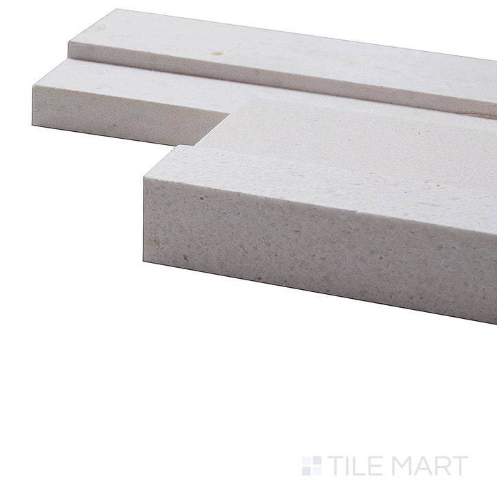 A corner perspective of the Modern Ledgestone Blanc 6x24 porcelain tile emphasizes its crisp white hue and subtle stone-like texture, creating a clean and contemporary design.