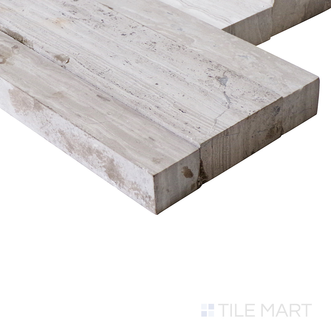 A side view enhances the soft white wood-inspired design of this ledgestone porcelain tile, bringing out its natural charm.