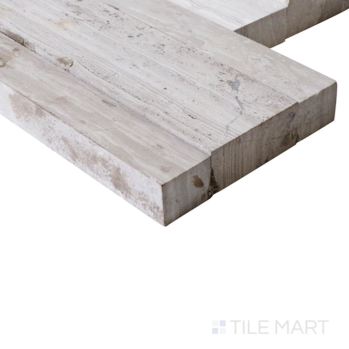 A side view enhances the soft white wood-inspired design of this ledgestone porcelain tile, bringing out its natural charm.
