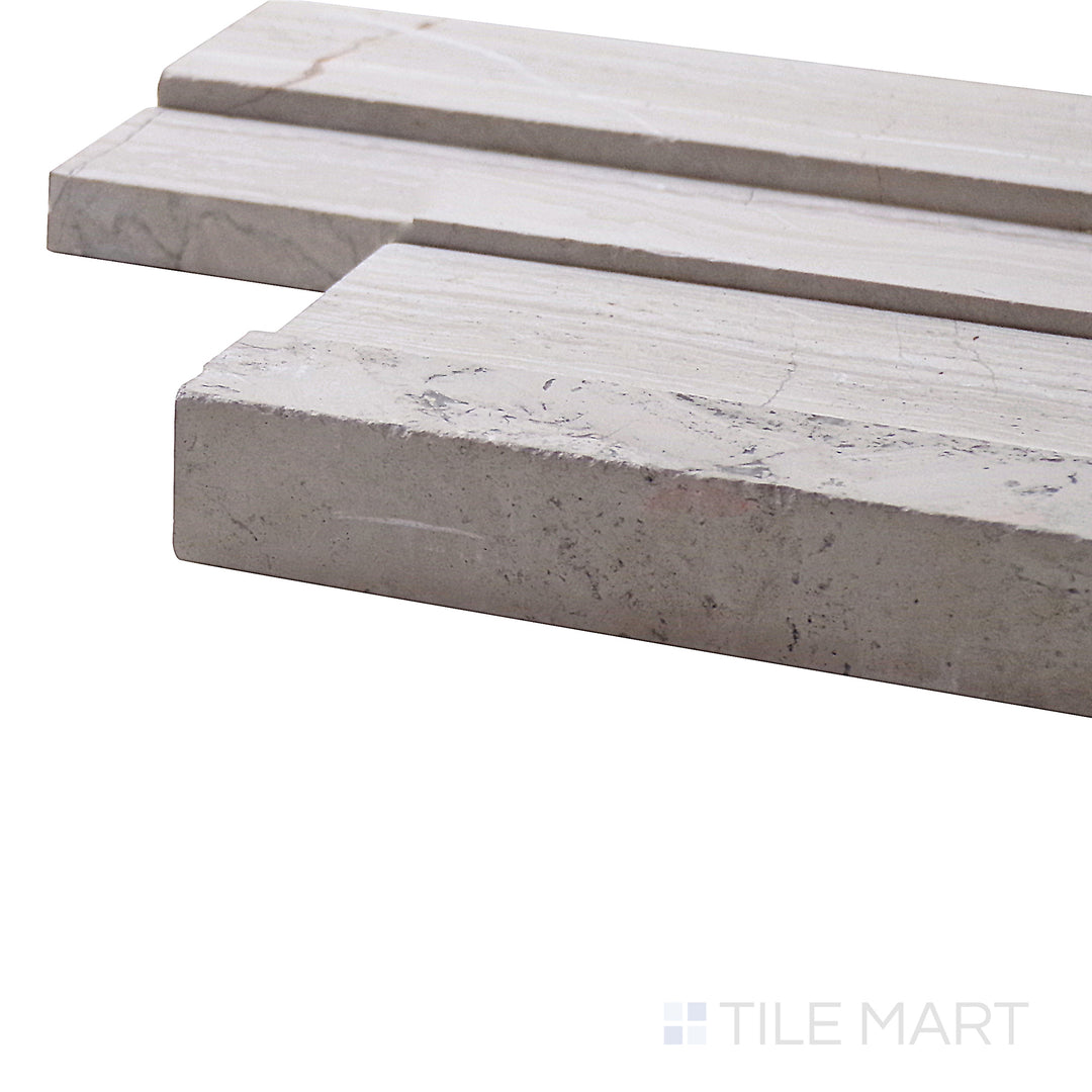 A corner perspective of the Modern Ledgestone White Wood 6x24 porcelain tile emphasizes its whitewashed wood-inspired texture, delivering a fresh and rustic charm.