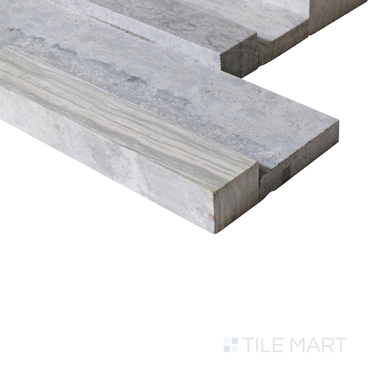 An angled close-up showcases the striking blue wood texture of this ledgestone tile, adding a fresh and unique touch to its surface.