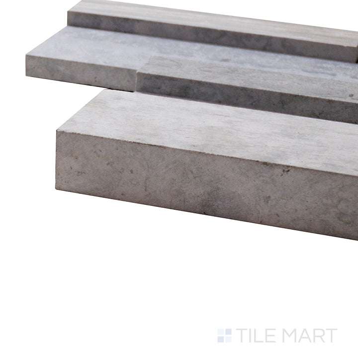 A corner shot of the Modern Ledgestone Wooden Blue 6x24 porcelain tile highlights its unique blue-gray wood texture, adding a stylish and coastal-inspired feel to any space.