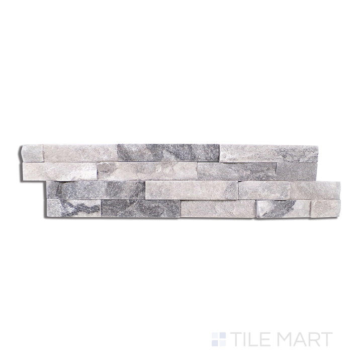Flat lay of Natural Splitface Stackstone Panels Alaska Grey 6X24, highlighting a mix of cool grey tones with a rough, textured stone surface.