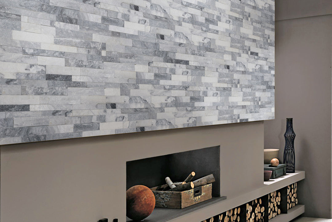 An inviting space adorned with Natural Splitface Stackstone Panels Alaska Grey 6X24, enhancing depth and character with its textured elegance.