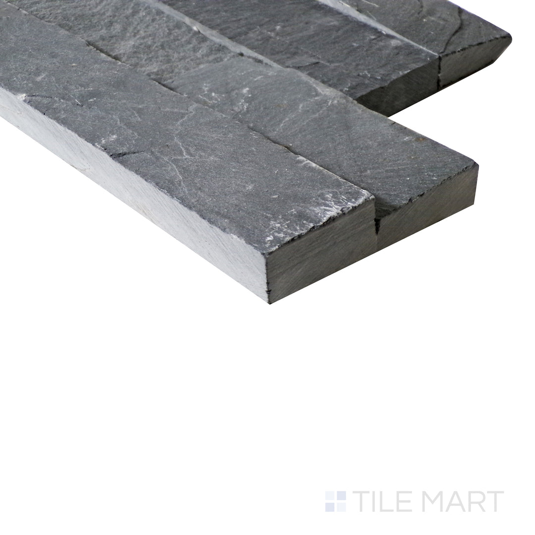 A side-angle perspective enhances the deep, moody Midnight stackstone, bringing out its dramatic texture and natural stone layering.