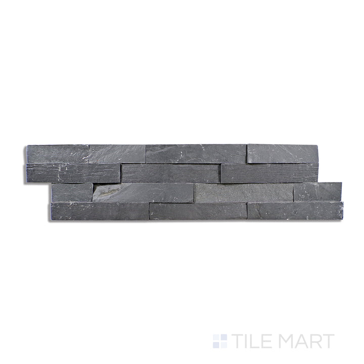 Flat lay of Natural Splitface Stackstone Panels Midnight 6X24, showcasing deep, dramatic black stone with a bold, rugged texture.