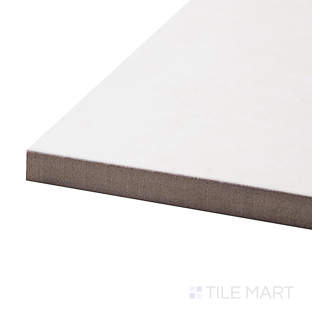 A corner shot of the Lugano Marfil 24x24 polished porcelain tile highlights its warm beige tones and reflective finish, delivering a luxurious and sophisticated look.