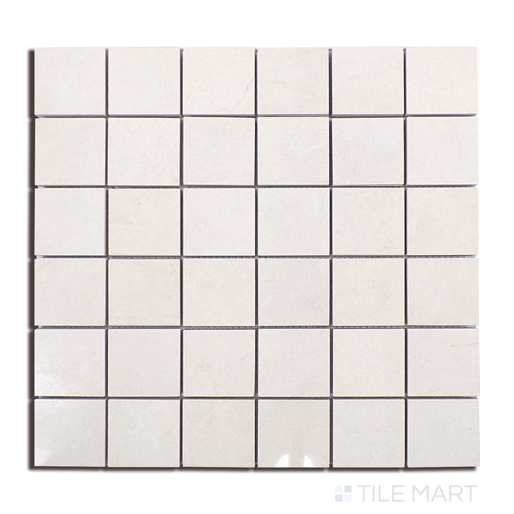 Flat lay of Lugano Marfil 2" Square Polished Porcelain Mosaic, displaying a mosaic arrangement of beige-toned polished porcelain with subtle veining.
