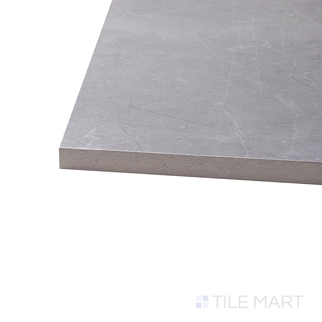 A corner shot of the Luxury Amani Grey 12x24 polished porcelain tile highlights its rich gray tones and high-gloss finish, adding a sleek and contemporary touch to interiors.
