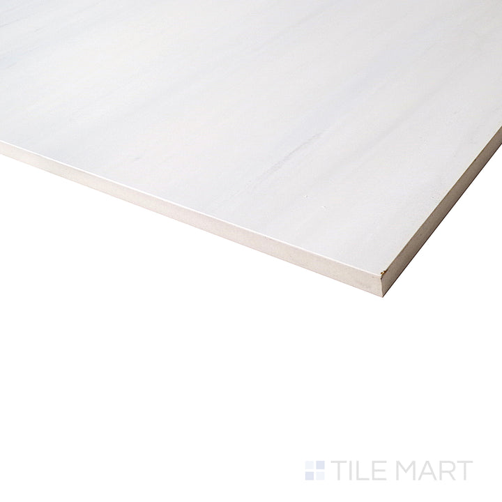 A side view captures the brilliant white surface of Deodat White porcelain, featuring delicate veining and a glossy finish for an elegant touch.