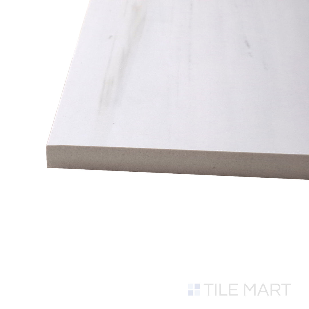 A corner perspective of the Luxury Deodat White 24x48 polished porcelain tile emphasizes its bright white hue and glossy texture, offering a clean and luxurious look.