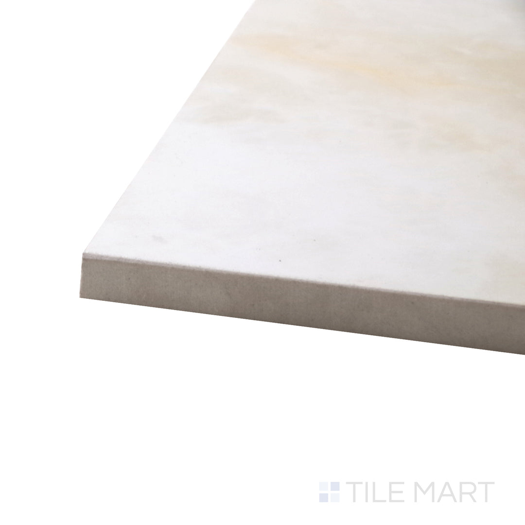 A corner shot of the Luxury Kristalus Cream 24x48 polished porcelain tile highlights its soft cream tones and reflective surface, adding warmth and sophistication to large spaces.